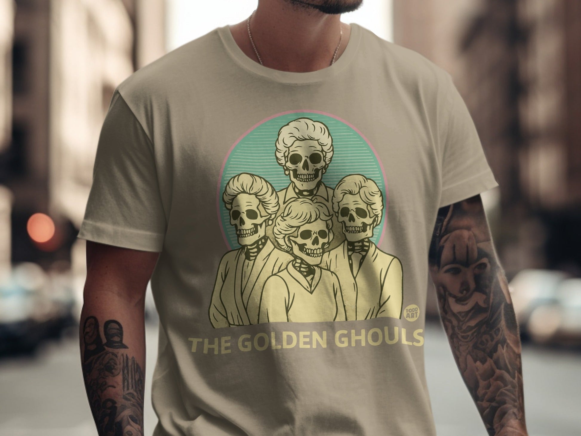 T-shirt with "The Golden Ghouls" text and a sketch of four skeletons.