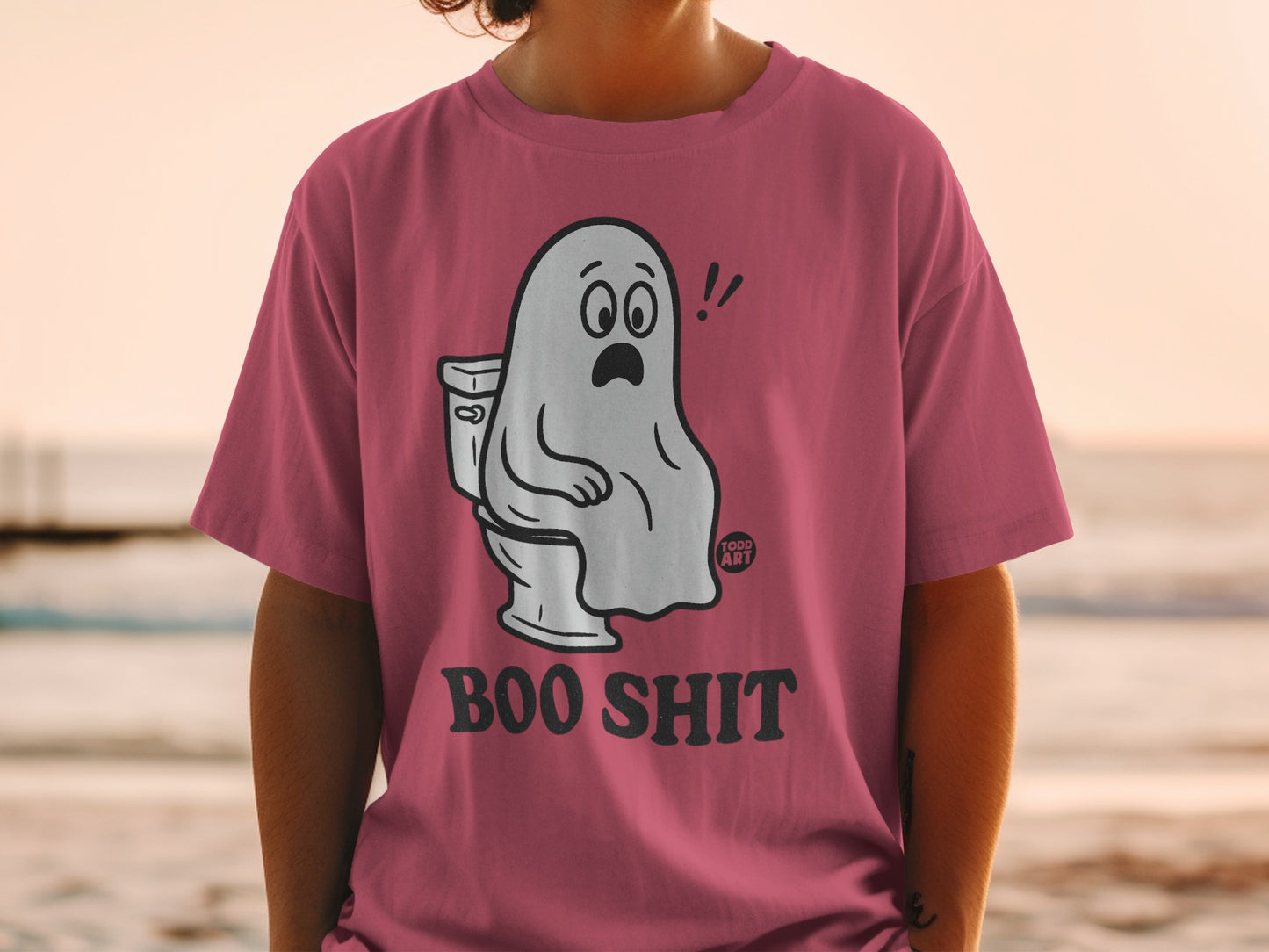 Pink t-shirt with cartoon ghost sitting on a toilet, text "BOO SHIT".