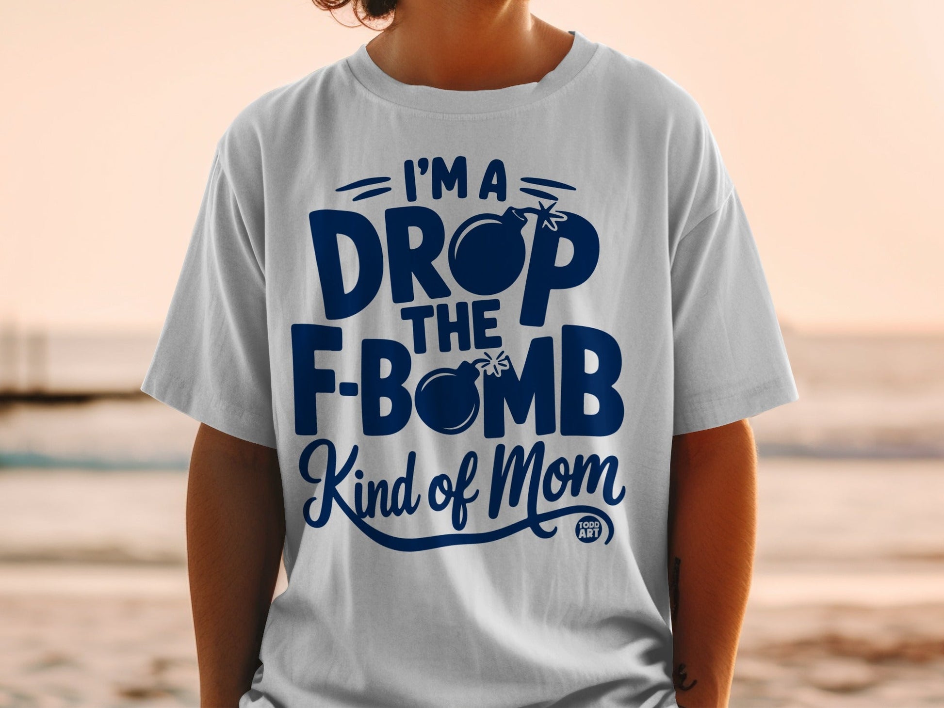 White t-shirt with blue text that reads "I'm a DROP THE F-BOMB Kind of Mom".