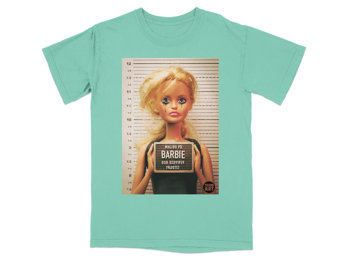 T-shirt featuring a Barbie doll mugshot with "MALIBU PD BARBIE" text.