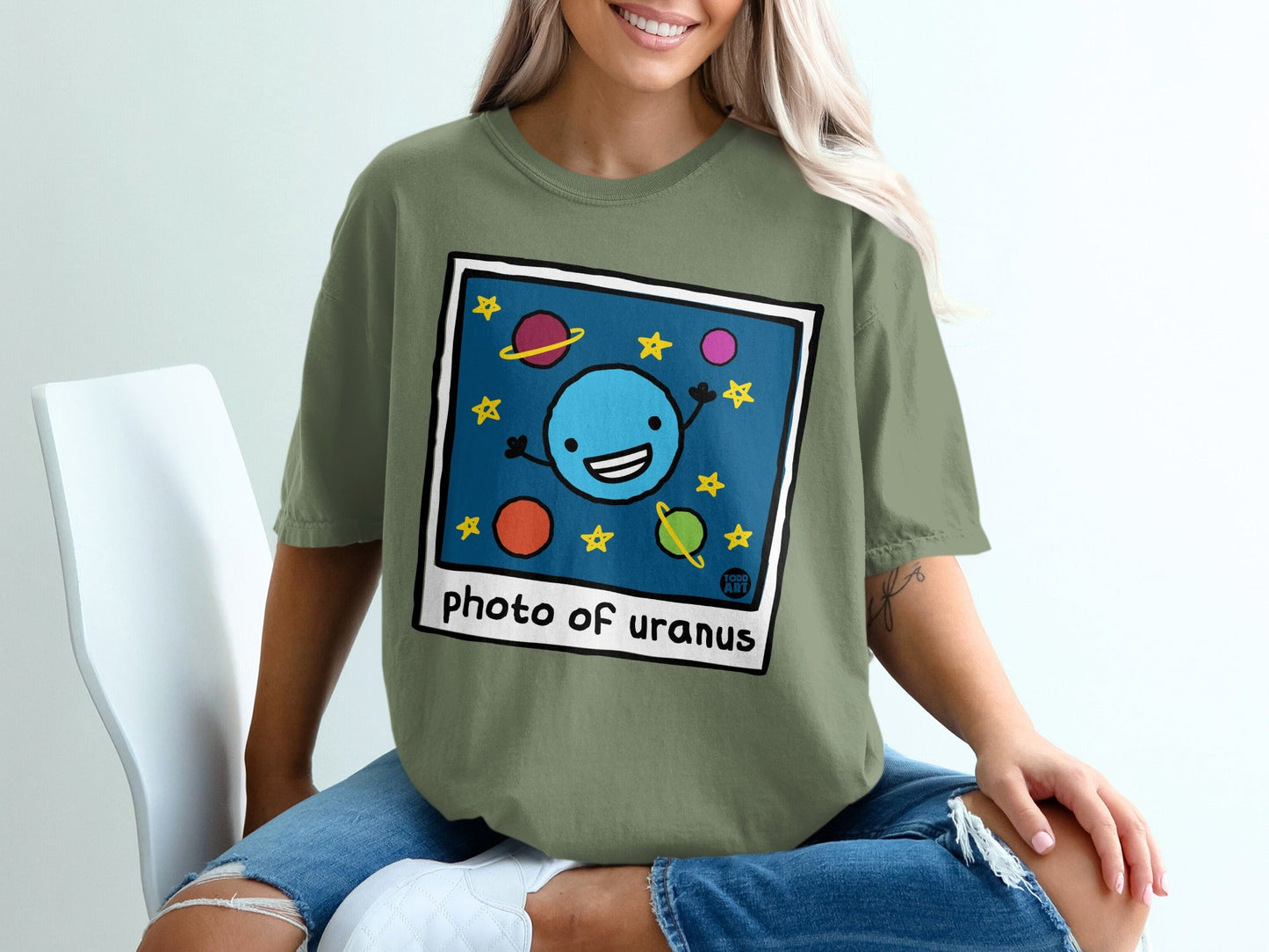 Cartoon planet Uranus smiling with stars and small planets.
