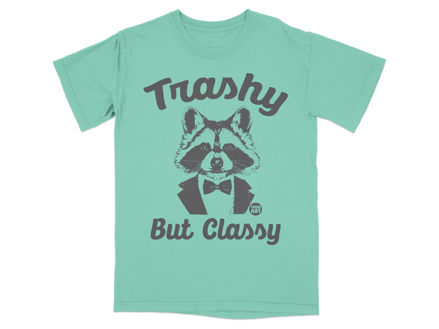 Teal t-shirt with a raccoon wearing a bow tie and the text "Trashy But Classy".