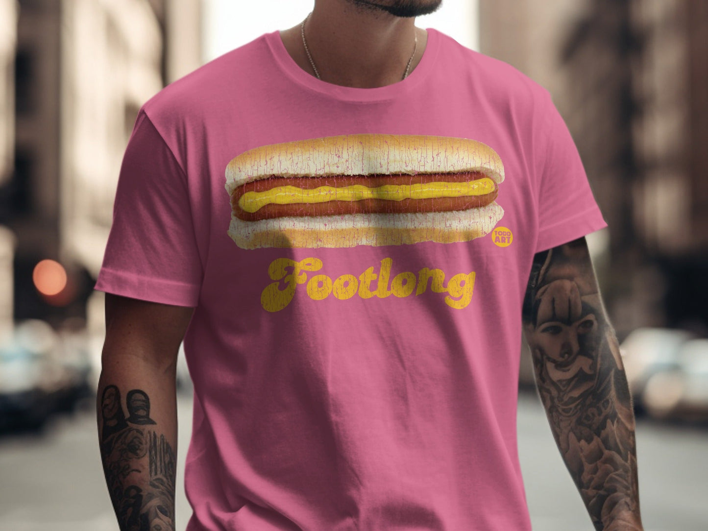 Pink t-shirt with "Footlong" text and a hot dog graphic.