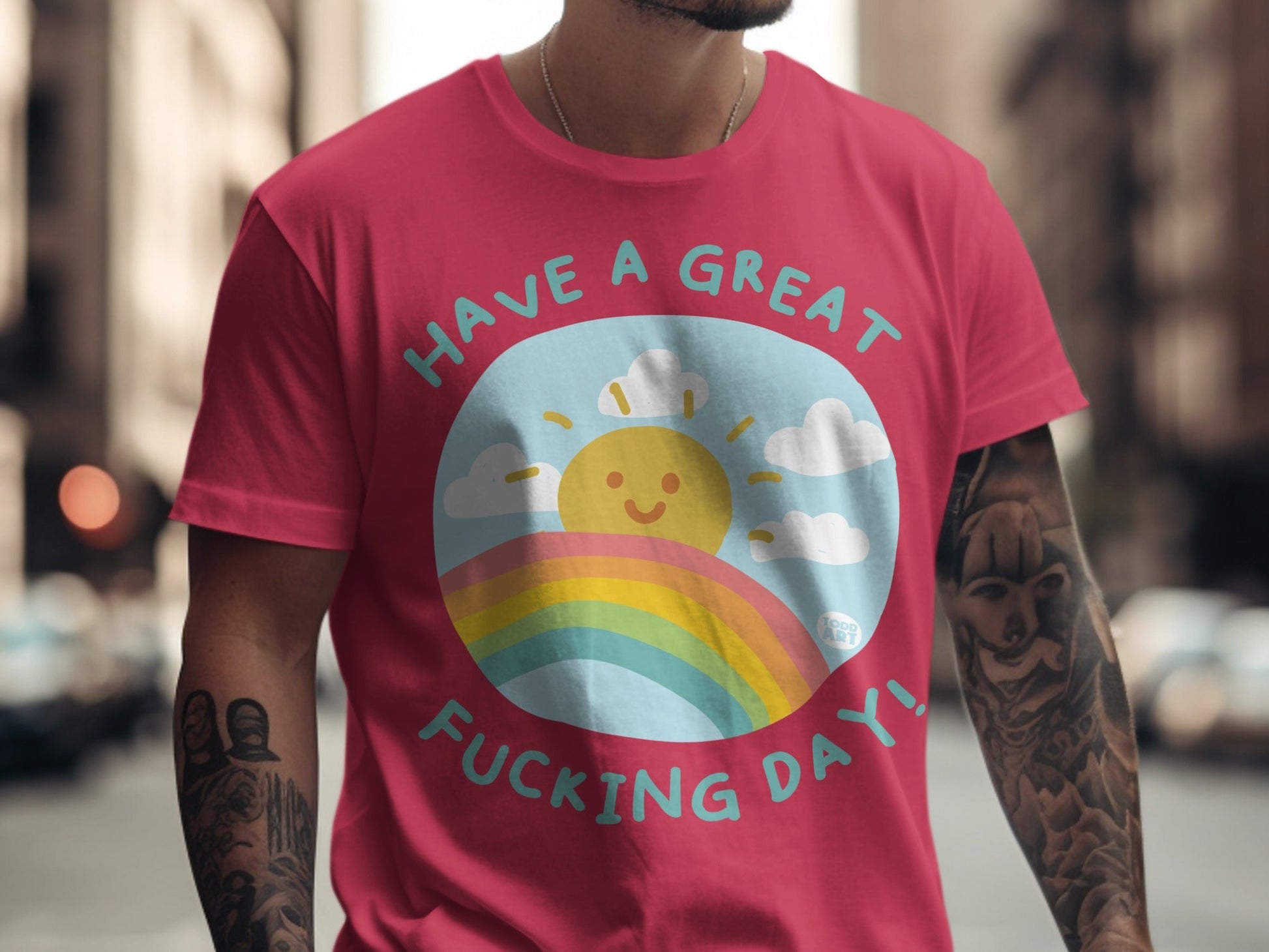 Red t-shirt with "Have a great fucking day!" and a smiling sun over a rainbow.