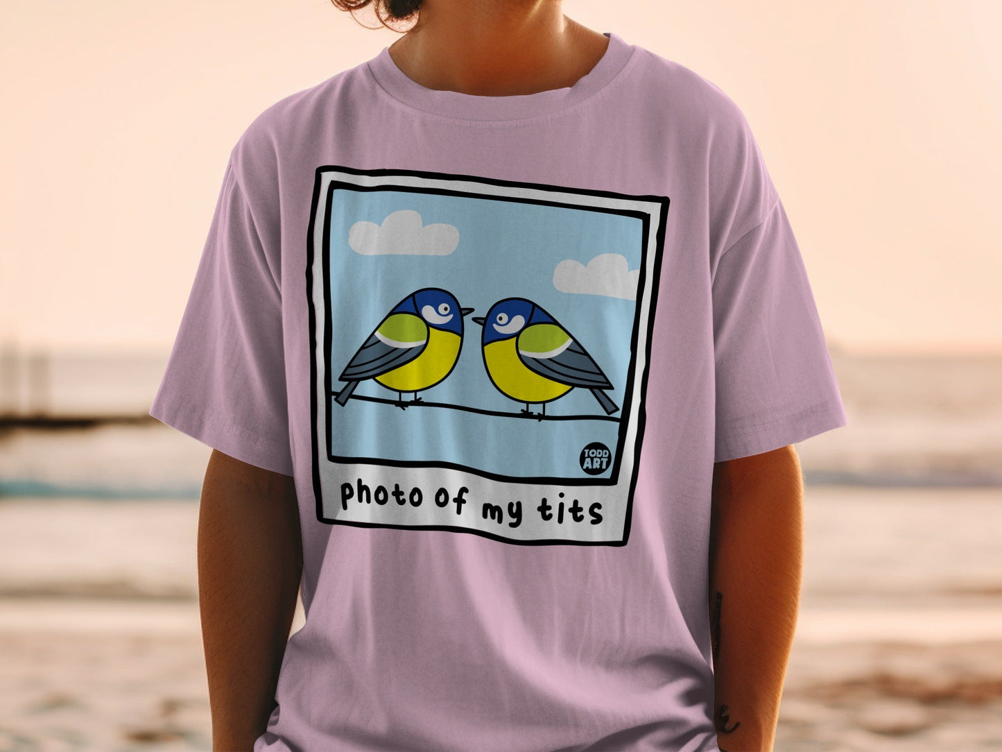Two blue and yellow birds perched on a wire, with text "photo of my tits".