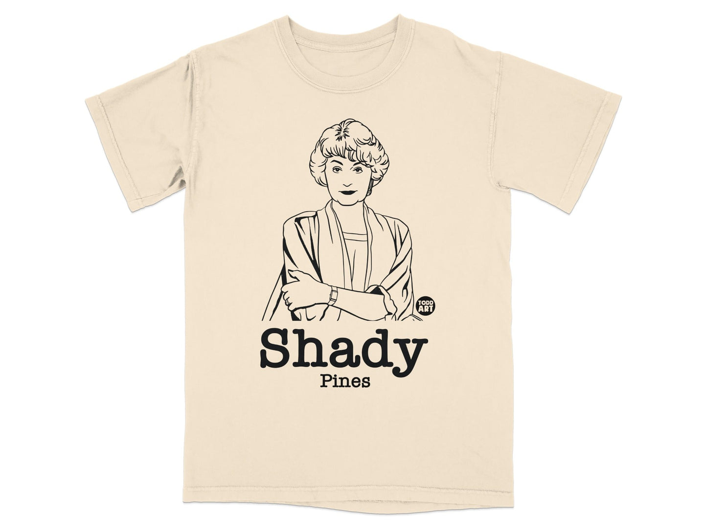 Cream t-shirt with a line drawing of a woman and "Shady Pines" text.