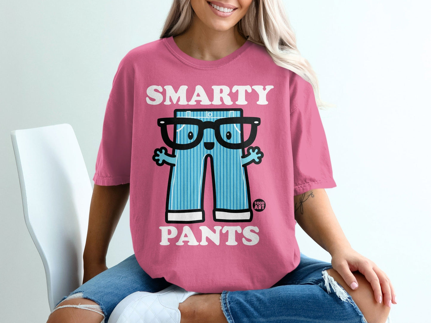 Pink t-shirt with cartoon pants graphic and "SMARTY PANTS" text.