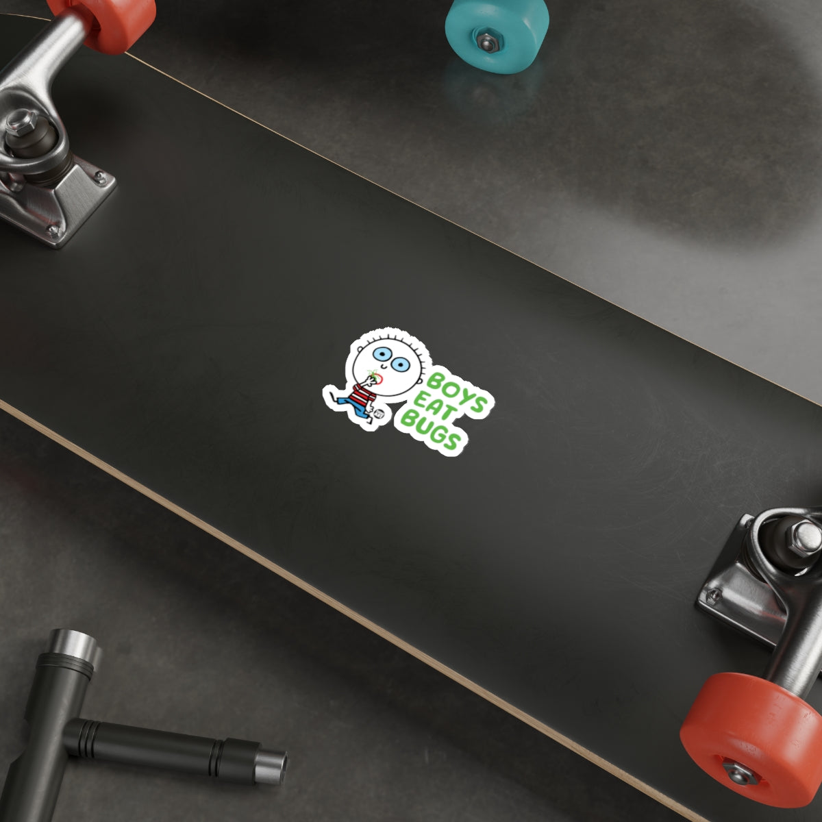 Boys Eat Bugs Sticker on Black Skateboard Deck