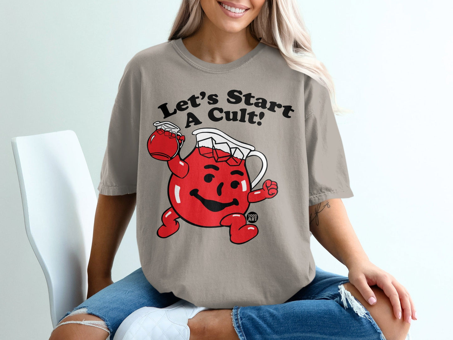 Kool-Aid Man on tan t-shirt with "Let's Start A Cult!" text.