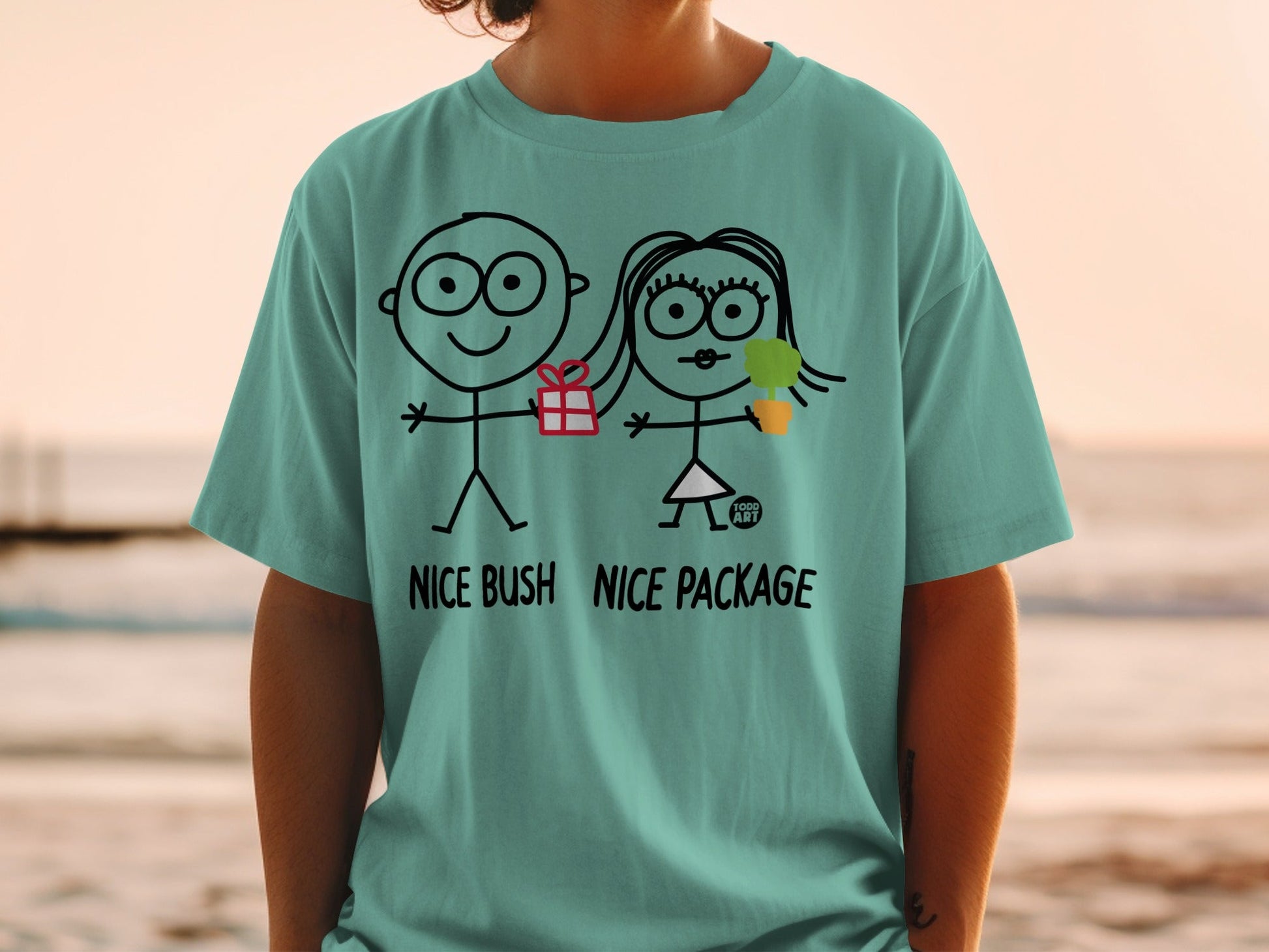 T-shirt with stick figures holding a gift and ice cream, text "NICE BUSH NICE PACKAGE".