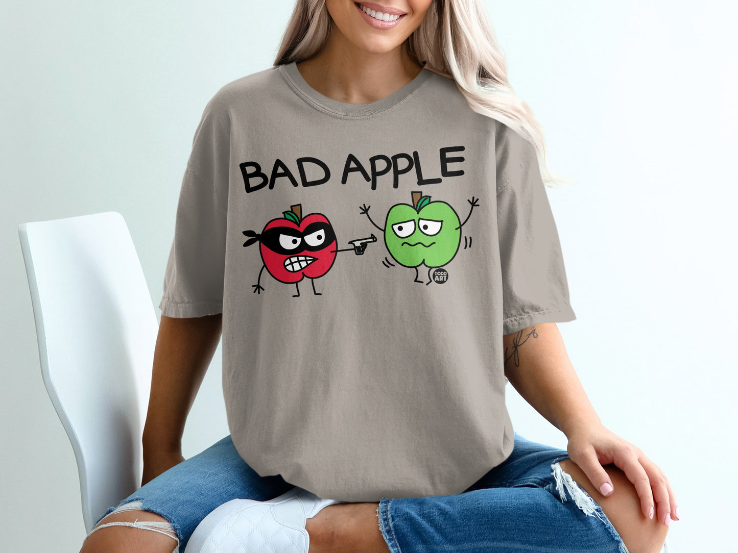 Bad Apple graphic red apple pointing gun green apple product type