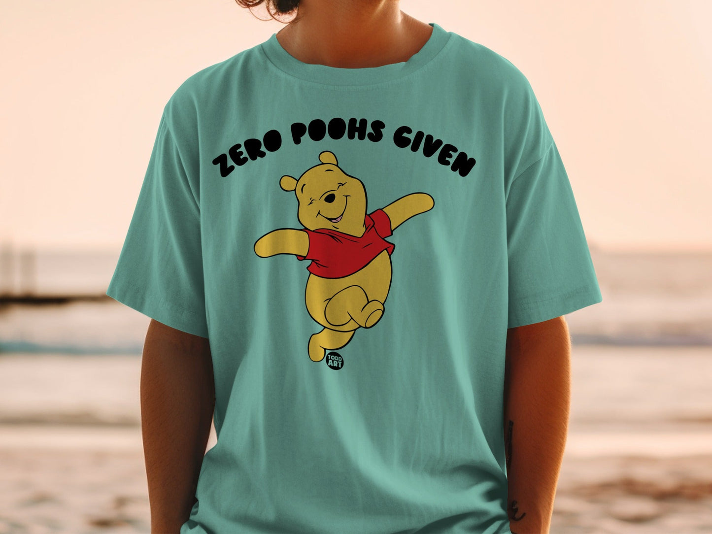 Winnie the Pooh character on t-shirt with "ZERO POOHS GIVEN" text.
