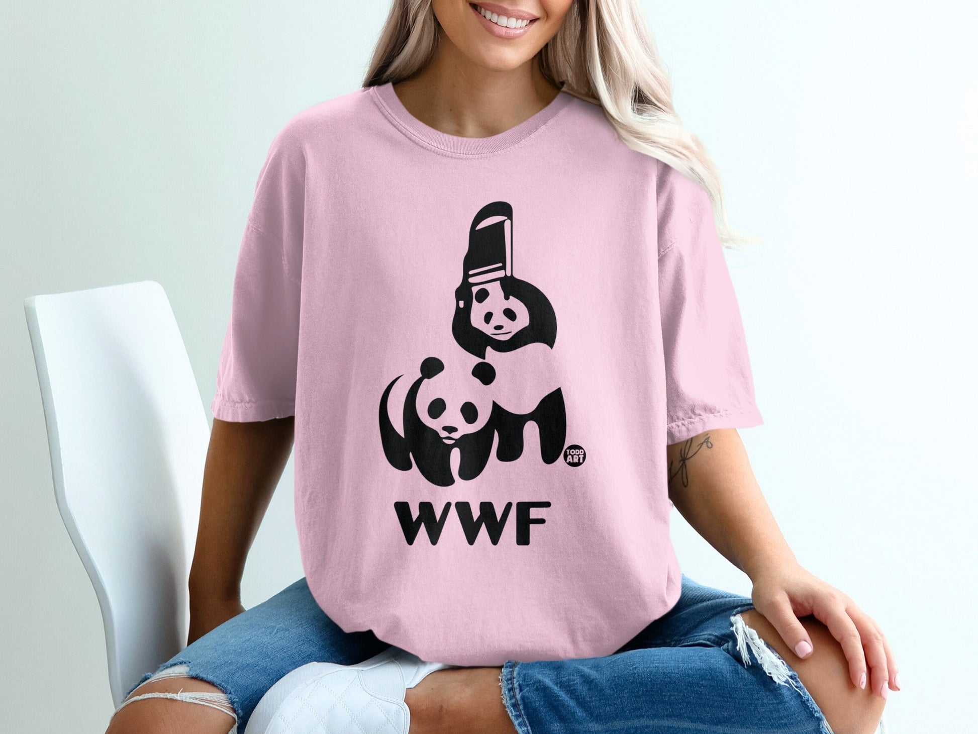 Pink t-shirt with WWF logo featuring two pandas and text.