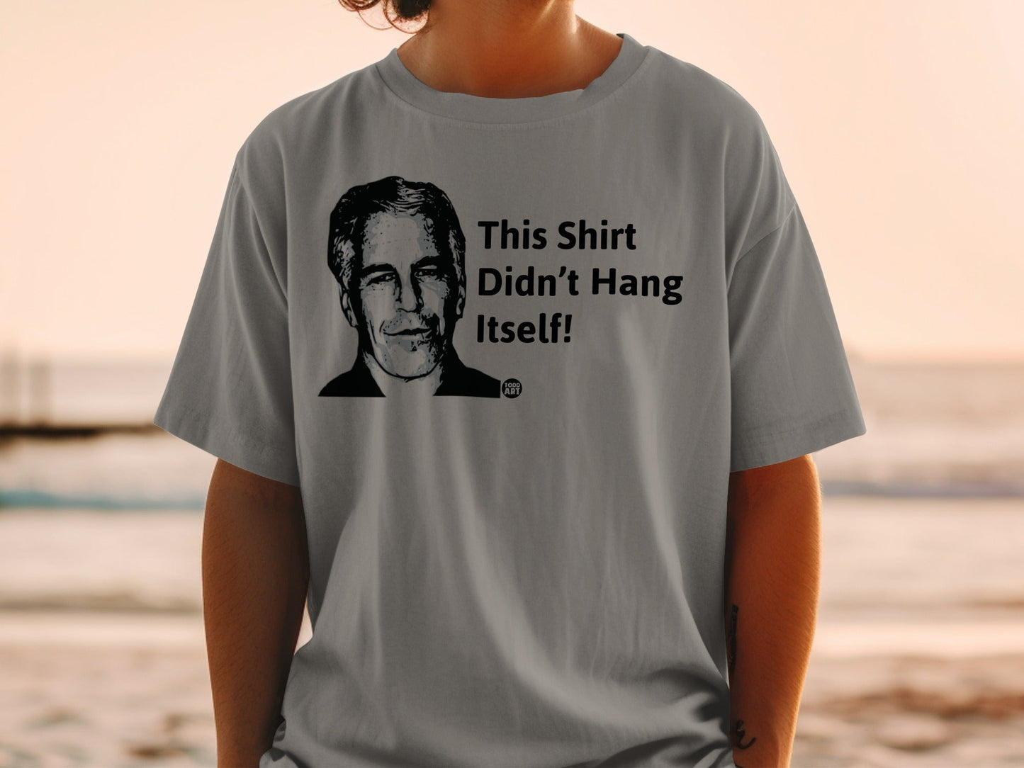 Grey t-shirt with portrait and "This Shirt Didn't Hang Itself!" text.