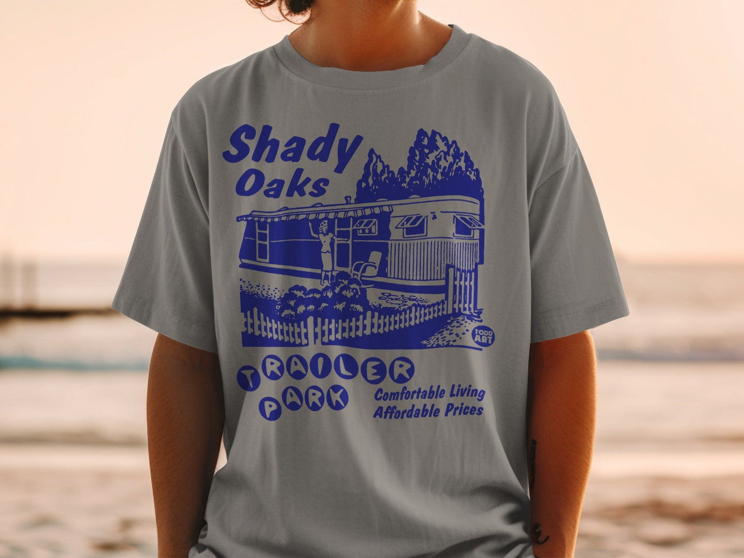 Shady Oaks Trailer Park t-shirt with blue graphic.