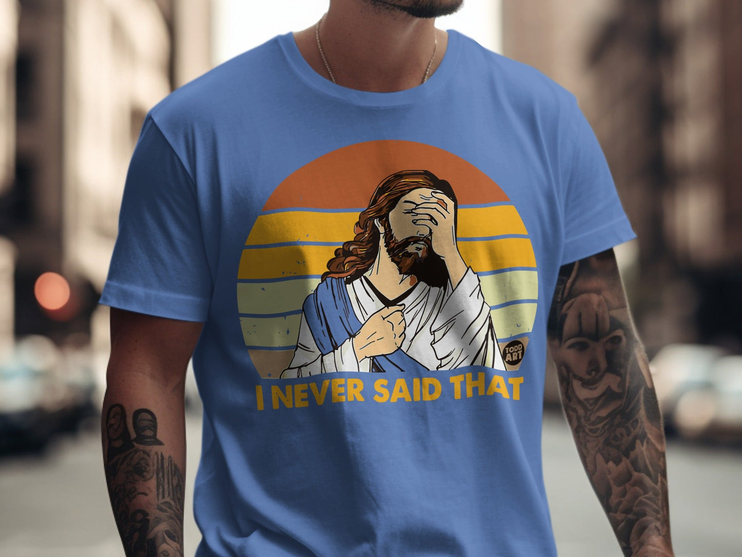 Blue t-shirt with Jesus graphic covering face and text "I NEVER SAID THAT".