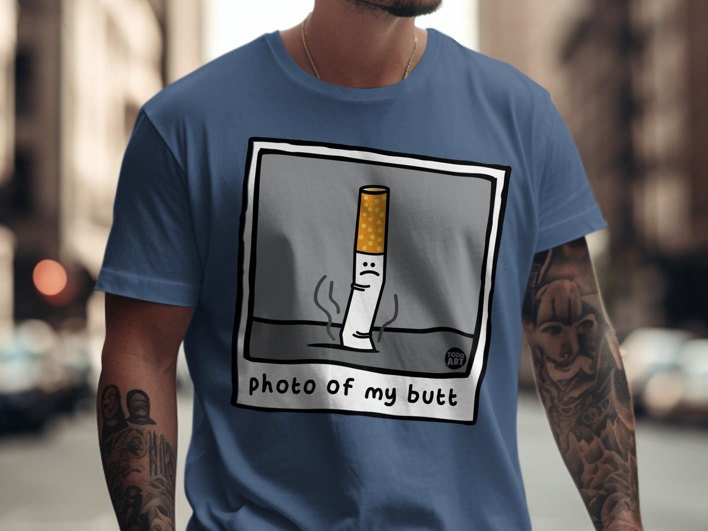 Cartoon cigarette with sad face on t-shirt with text "photo of my butt".
