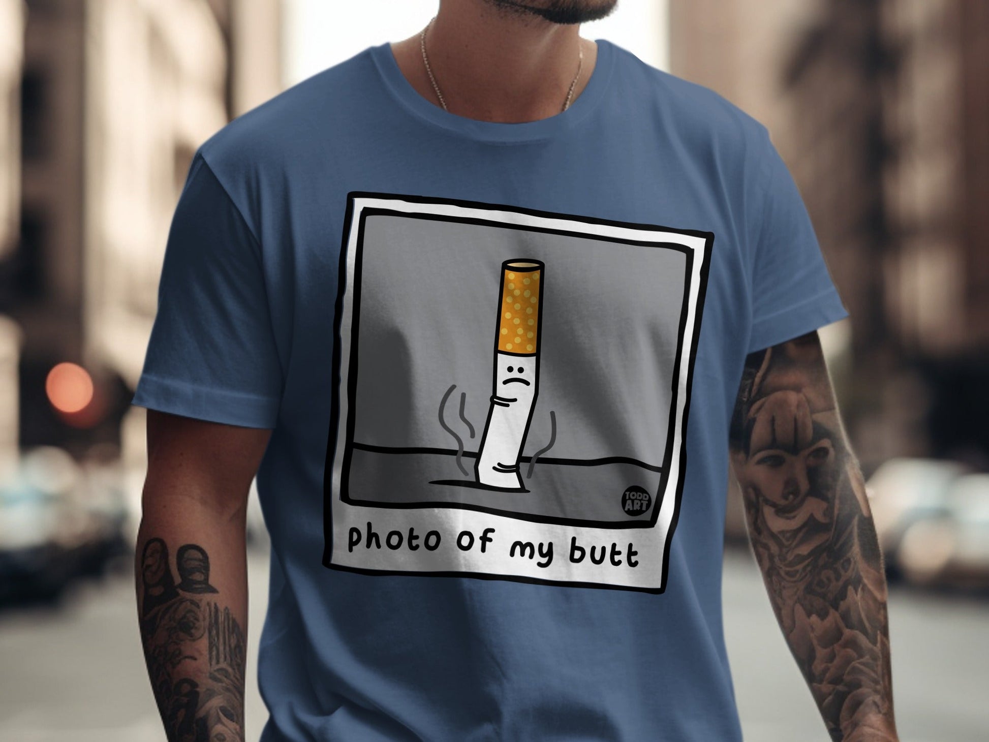 Cartoon cigarette with sad face on t-shirt with text "photo of my butt".
