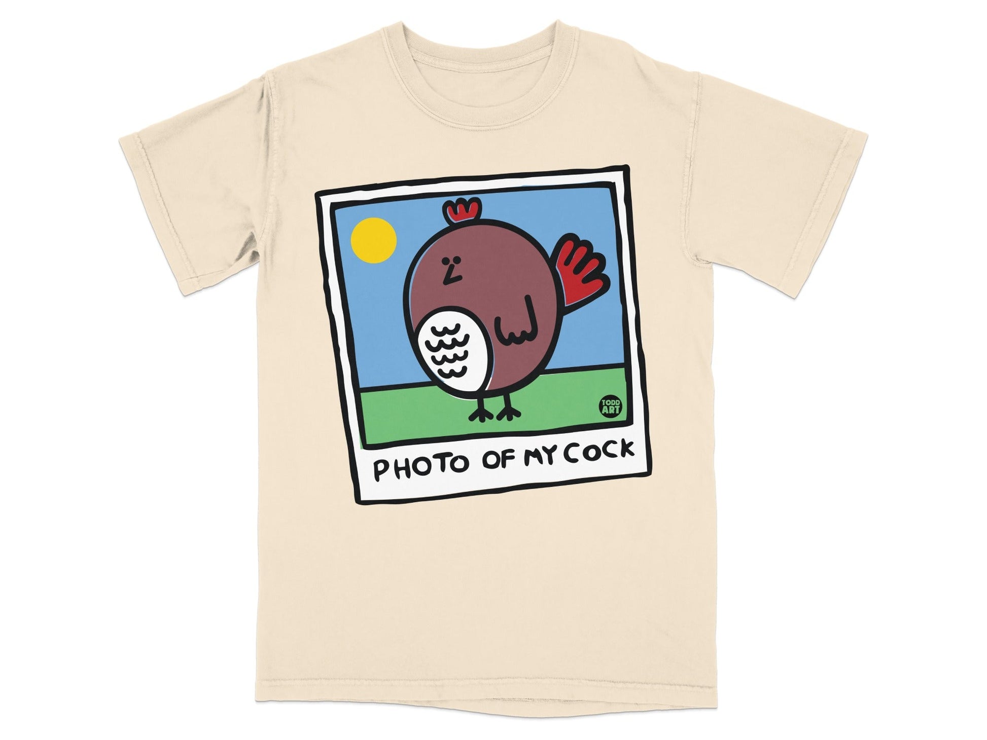Cream t-shirt with a cartoon rooster illustration and the text "PHOTO OF MY COCK".