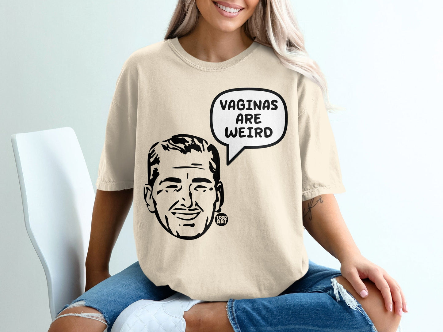 T-shirt with "VAGINAS ARE WEIRD" in speech bubble and cartoon man's face.