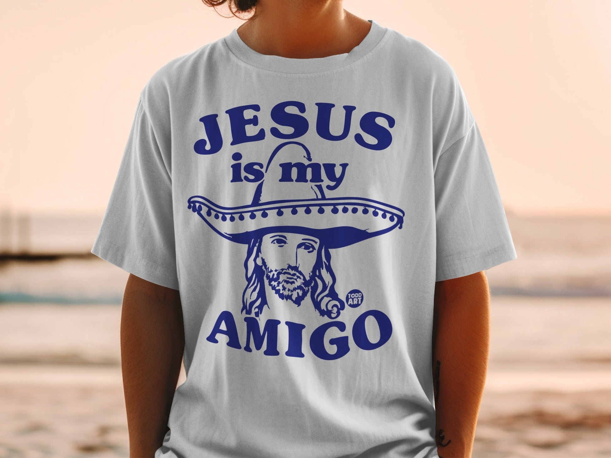 T-shirt with "Jesus is my amigo" and Jesus wearing a sombrero.