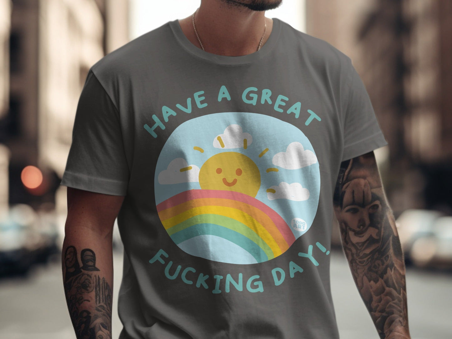Gray t-shirt with "HAVE A GREAT FUCKING DAY!" and a sun and rainbow graphic.