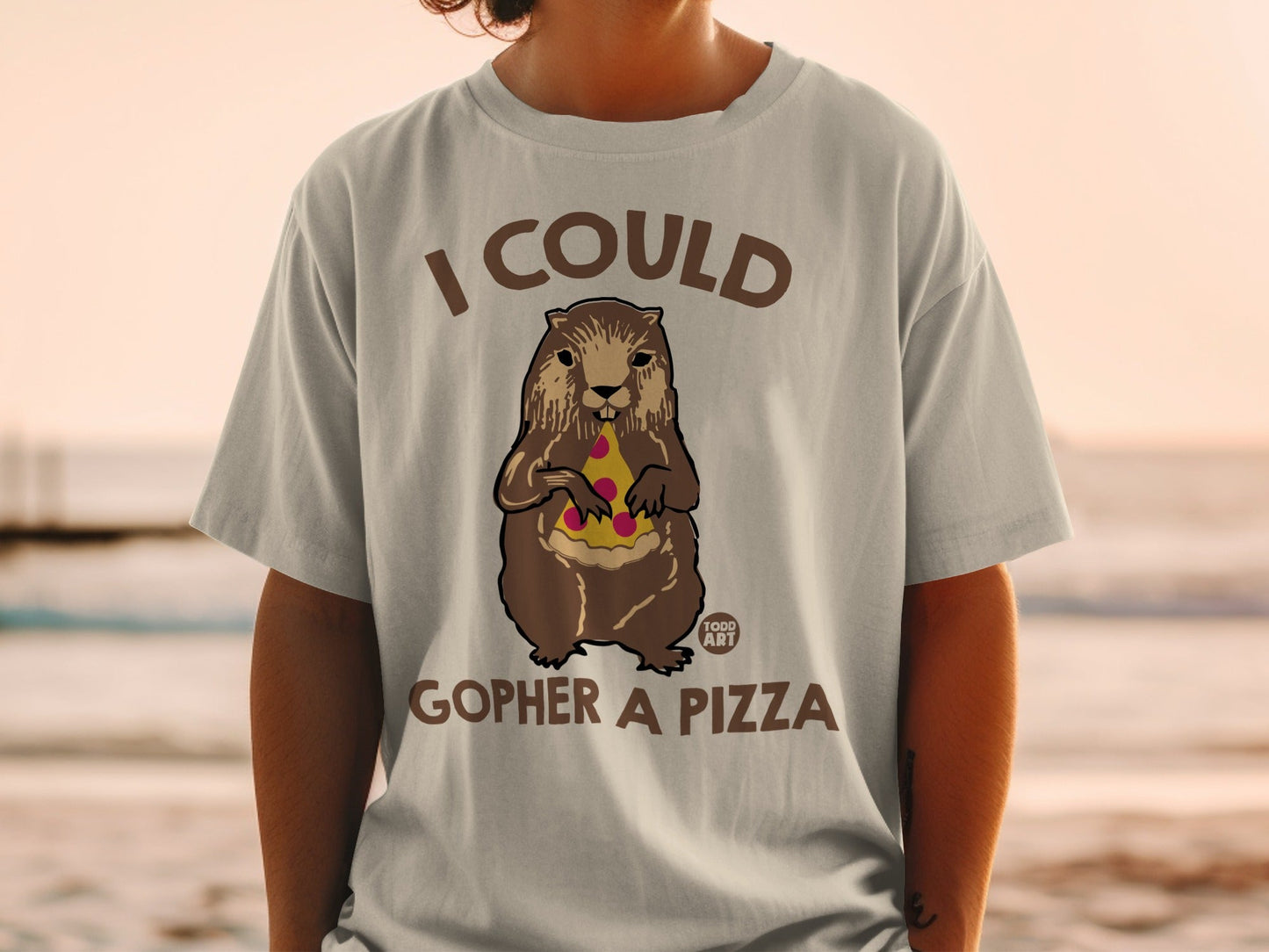 T-shirt with illustration of a gopher holding pizza, text "I Could Gopher a Pizza".