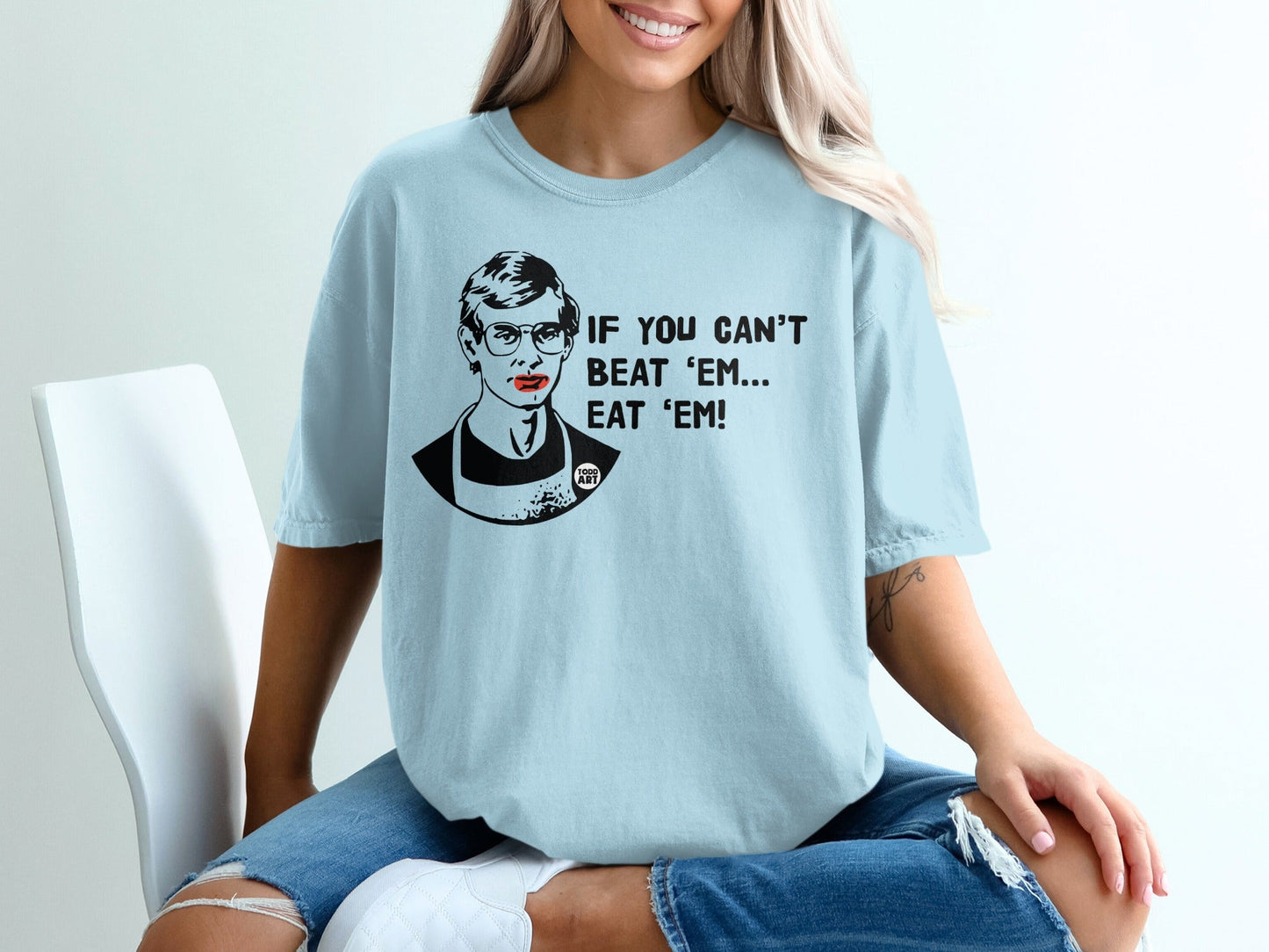 Light blue t-shirt with text "IF YOU CAN'T BEAT 'EM... BEAT 'EM!".
