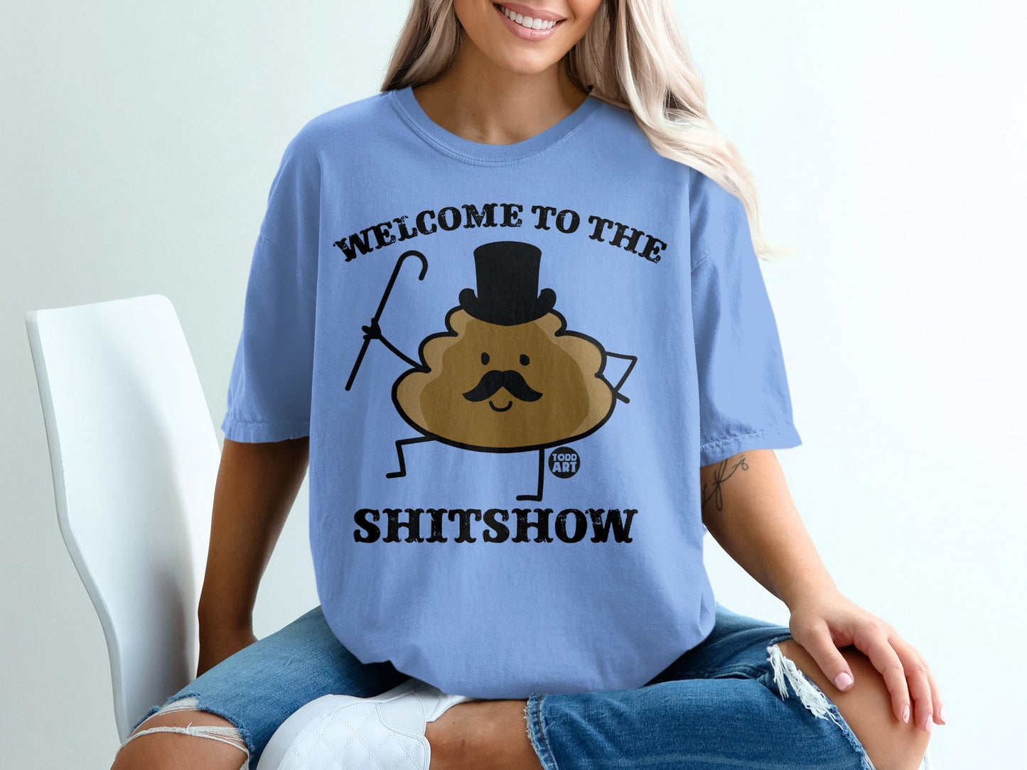 Blue t-shirt with "Welcome to the Shitshow" text and a cartoon poop character.