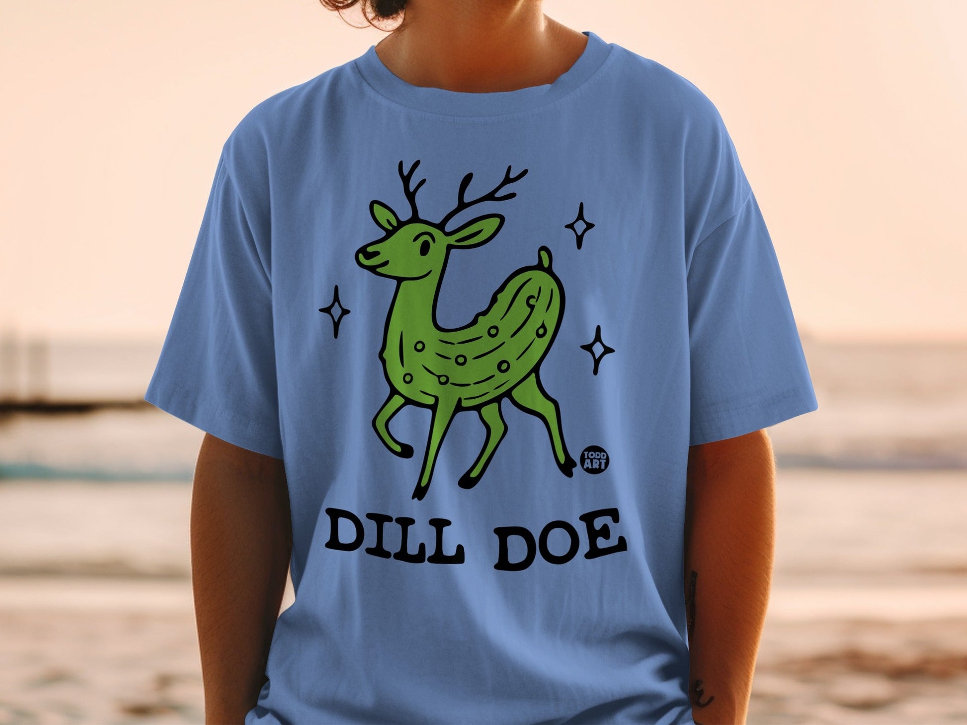 Green cartoon deer with pickle skin texture and "DILL DOE" text.