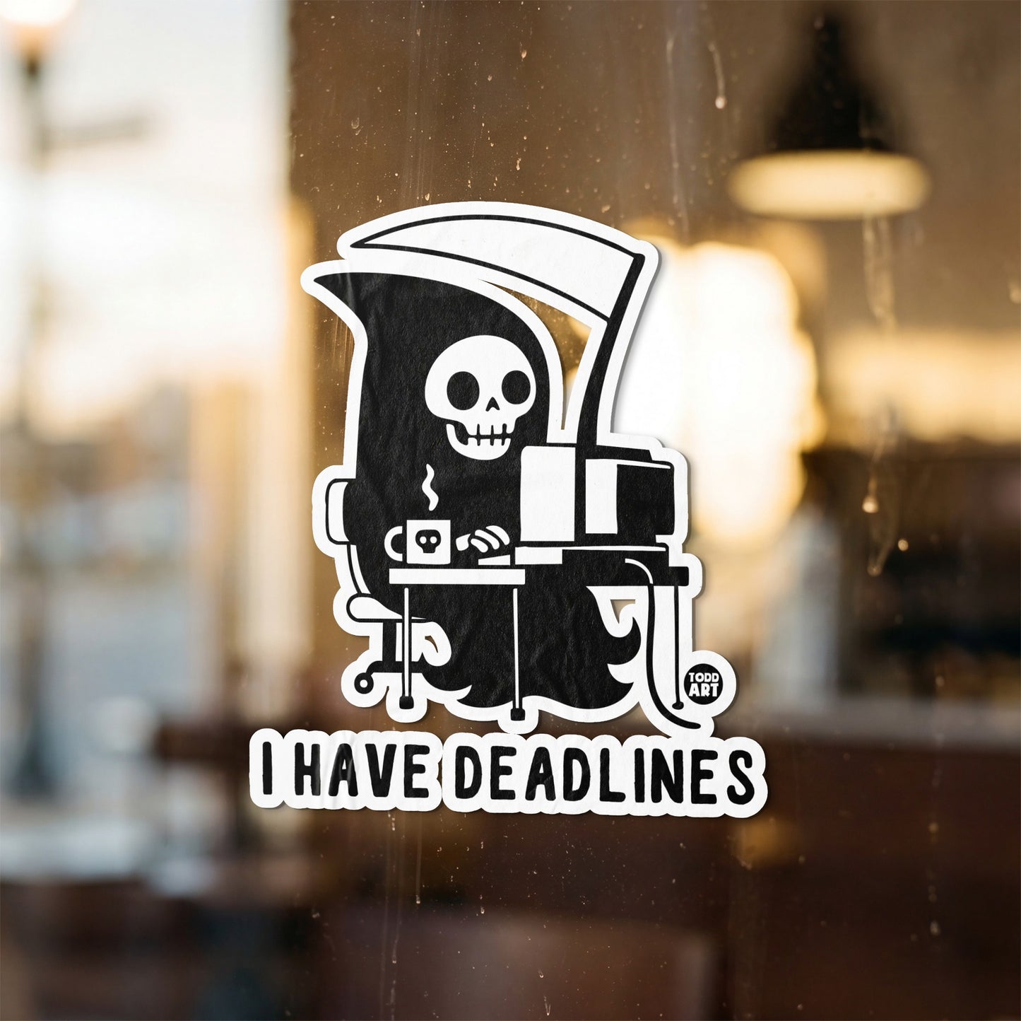 Grim Reaper at a computer with coffee mug, saying "I HAVE DEADLINES".