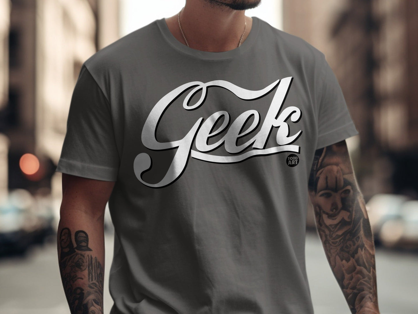 Dark grey t-shirt with "Geek" logo and small "Food Art" text.