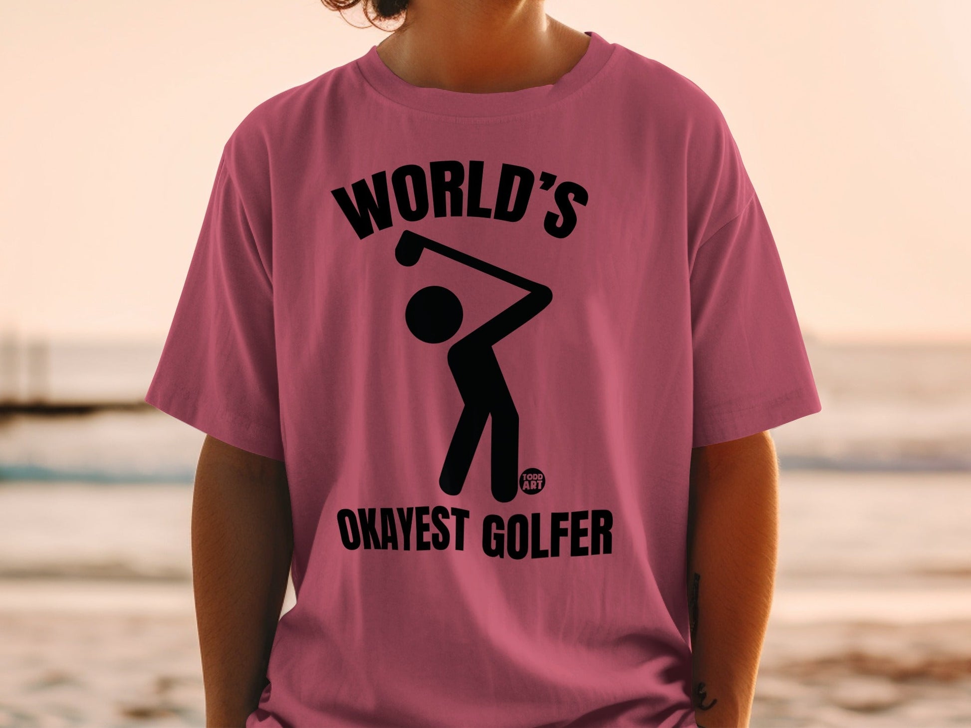 T-shirt with a golfer graphic and text "World's Okayest Golfer".