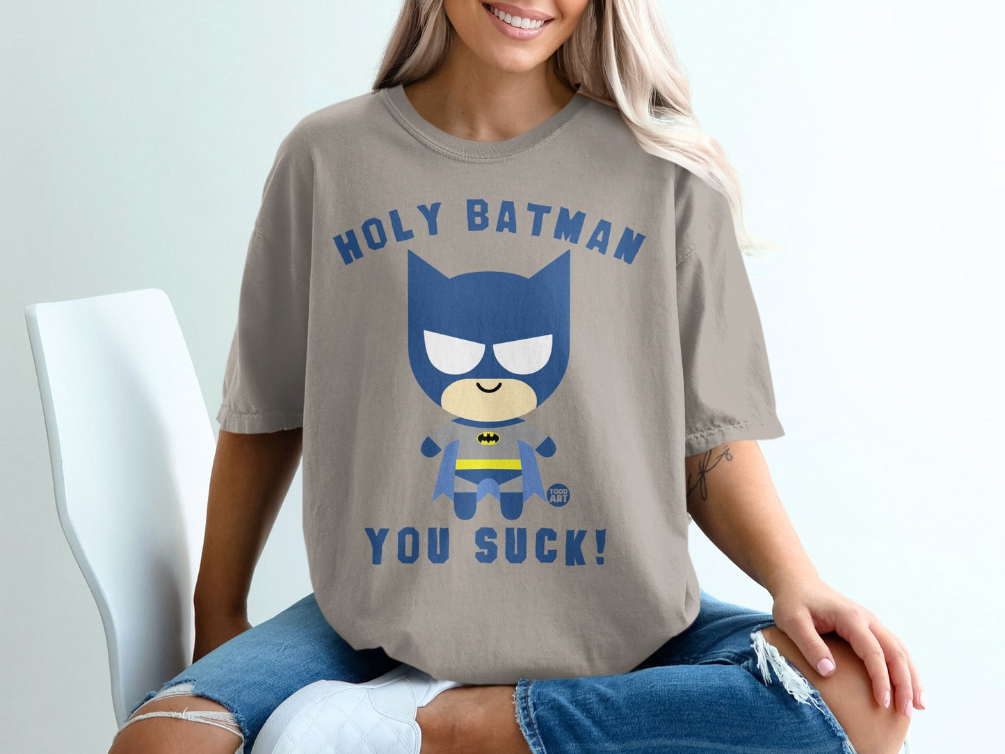 T-shirt with "Holy Batman you suck!" text and cartoon Batman graphic.