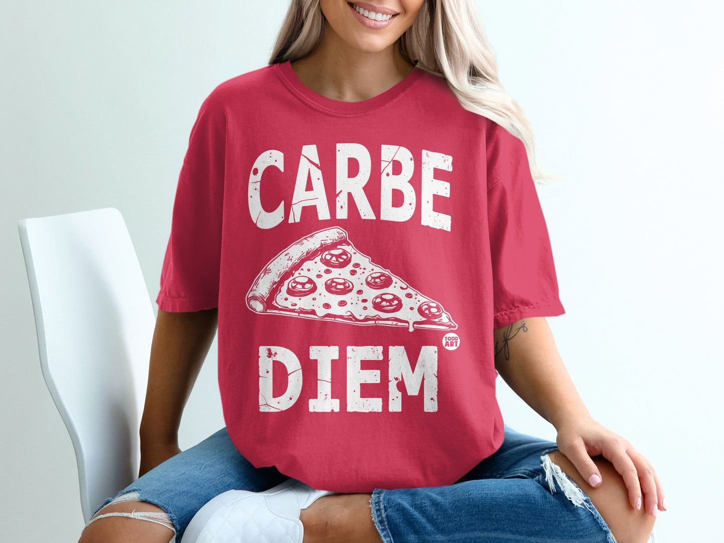 Woman wearing a red t-shirt with "Carpe Diem" and a pepperoni pizza slice.