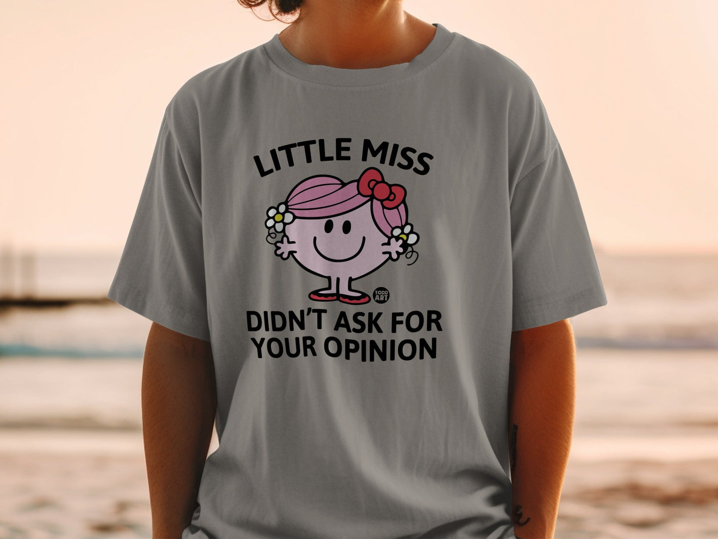 Little Miss character with "Didn't Ask For Your Opinion" text on a grey t-shirt.