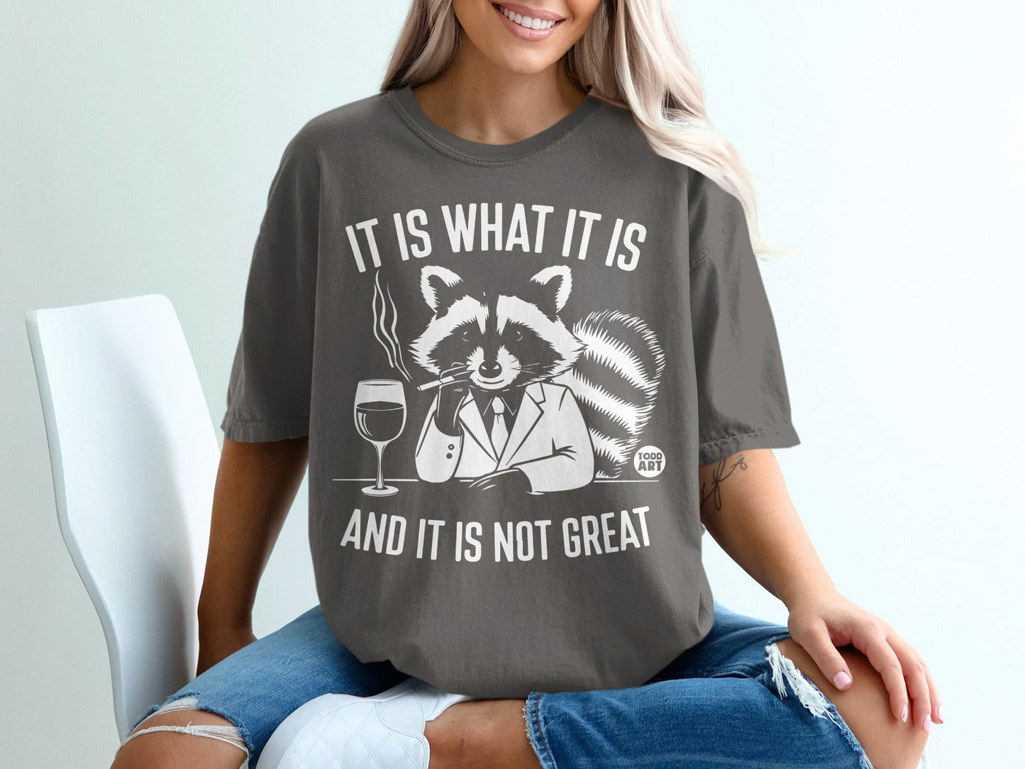 Raccoon in suit with cigar and wine glass, text "IT IS WHAT IT IS AND IT IS NOT GREAT".