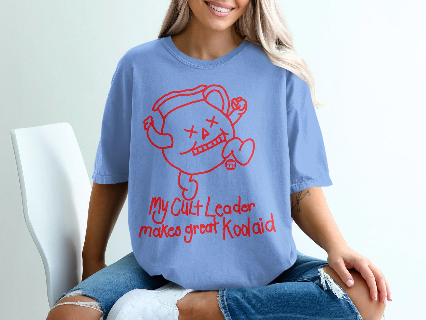 Blue t-shirt with red Kool-Aid Man graphic and "my cult leader makes great koolaid" text.
