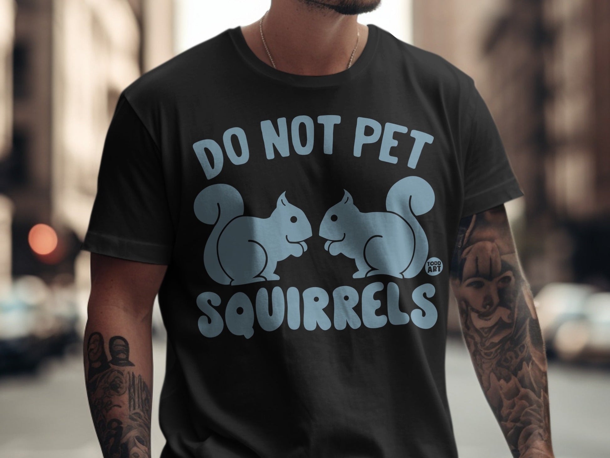 Black t-shirt with cartoon squirrels and "DO NOT PET SQUIRRELS" text.
