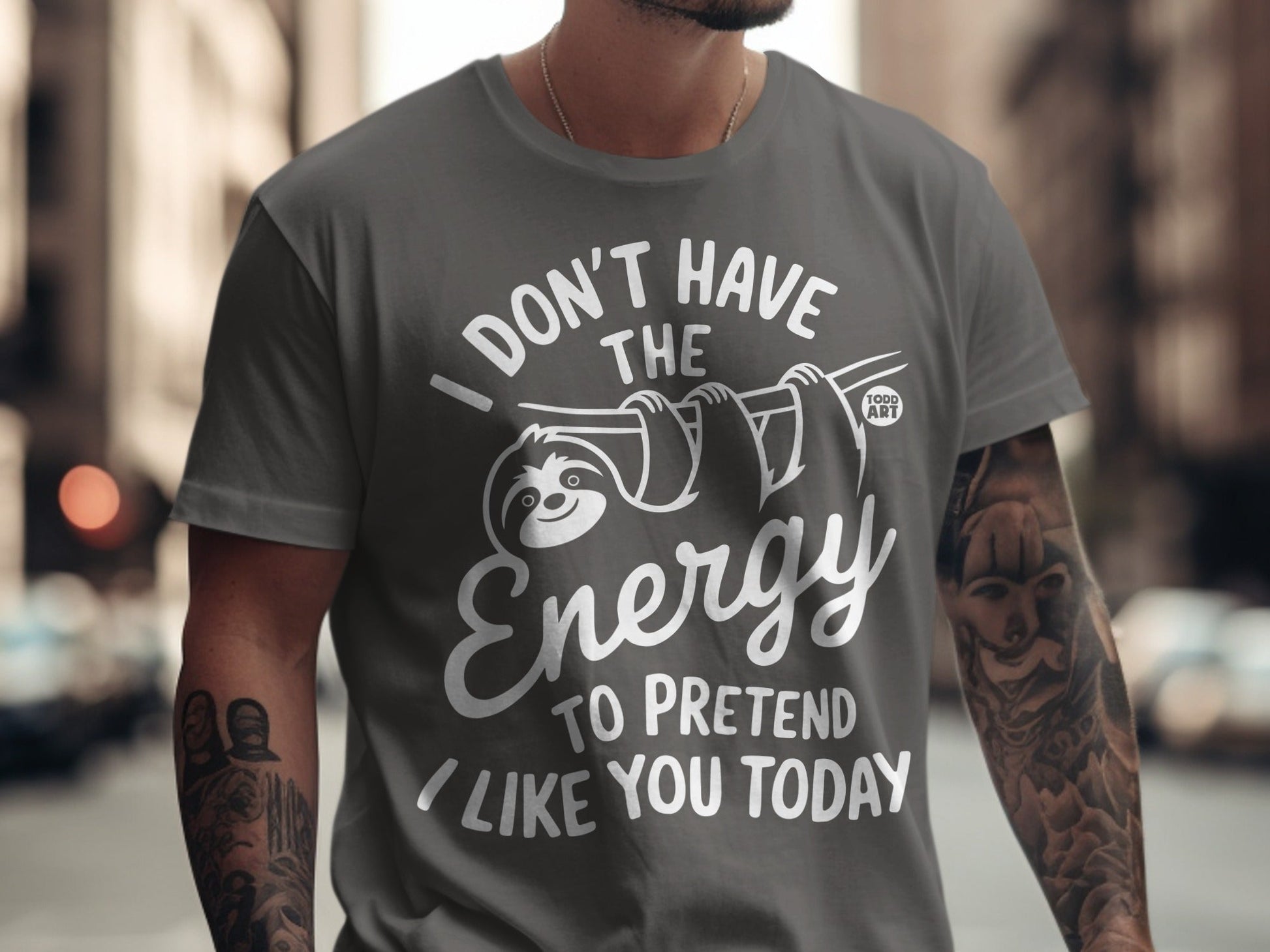 T-shirt with "I don't have the energy to pretend I like you today" text and sloth graphic.