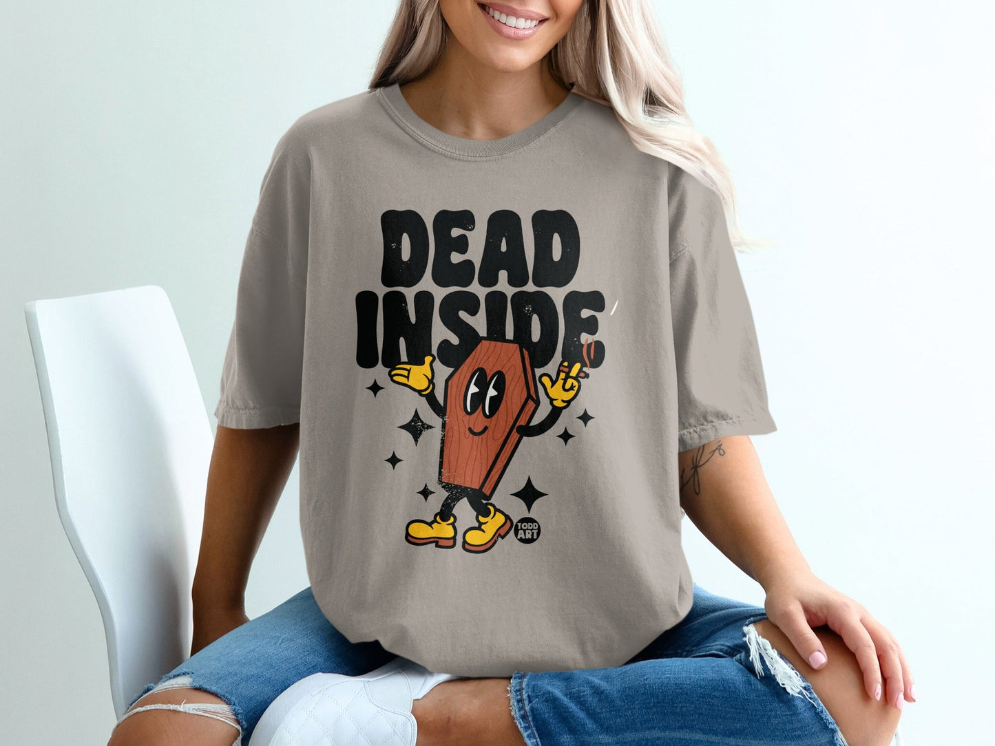 T-shirt with "DEAD INSIDE" text and cartoon coffin smoking a cigarette.