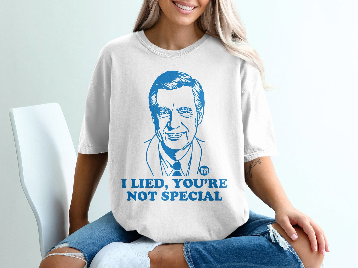 White t-shirt with Fred Rogers illustration and "I lied, you're not special" text.