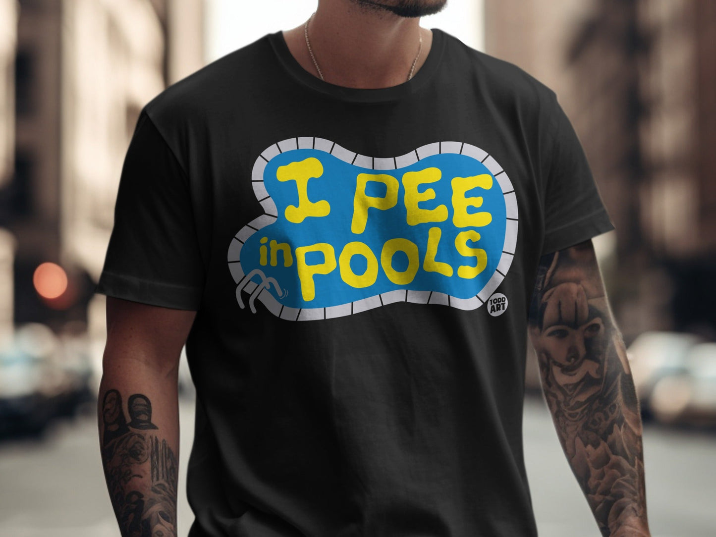Black t-shirt with "I PEE IN POOLS" text inside a pool shape.