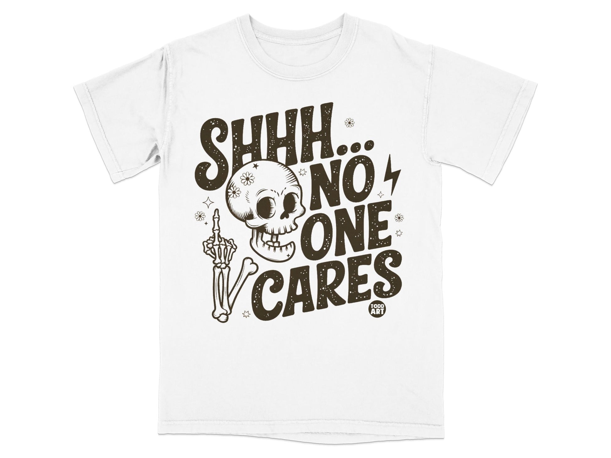 White t-shirt with brown graphic of skull, skeleton hand, and text "SHHH... NO ONE CARES"