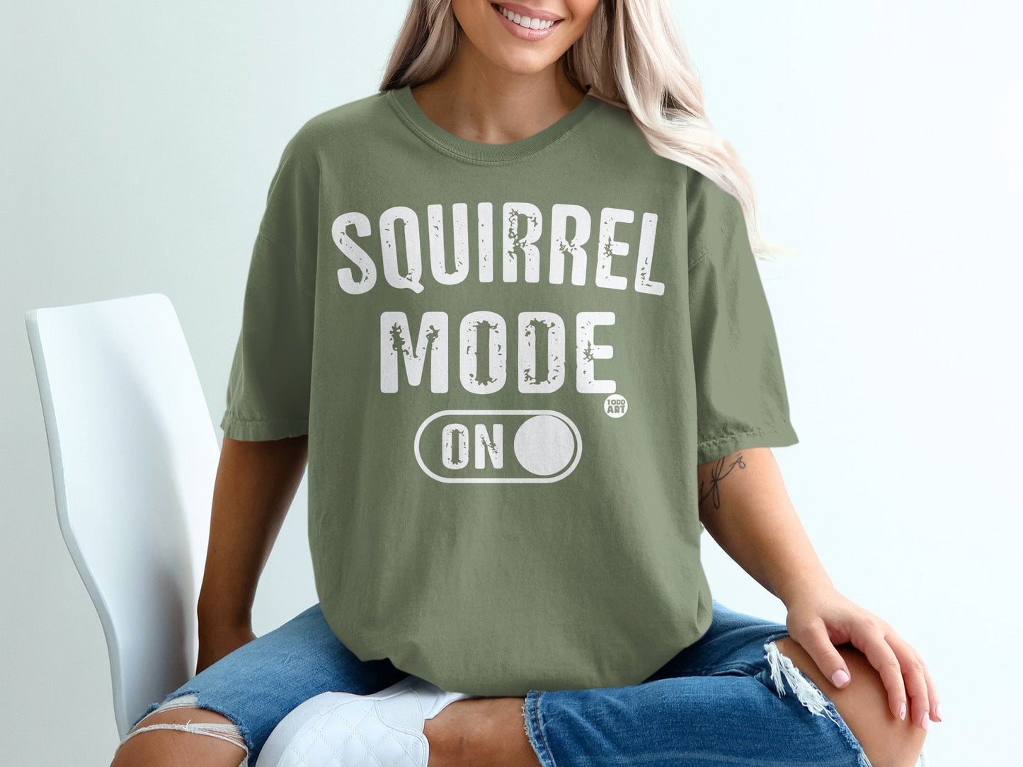 Green t-shirt with "Squirrel Mode ON" and a squirrel graphic.