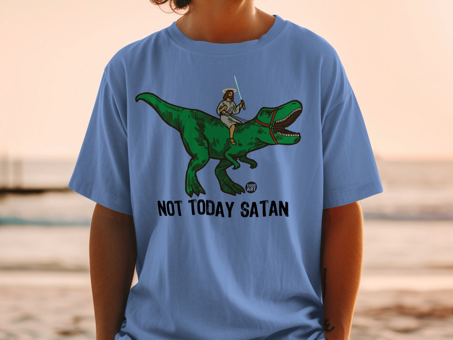 Jesus on a T-Rex with a lightsaber, "Not Today Satan" text.