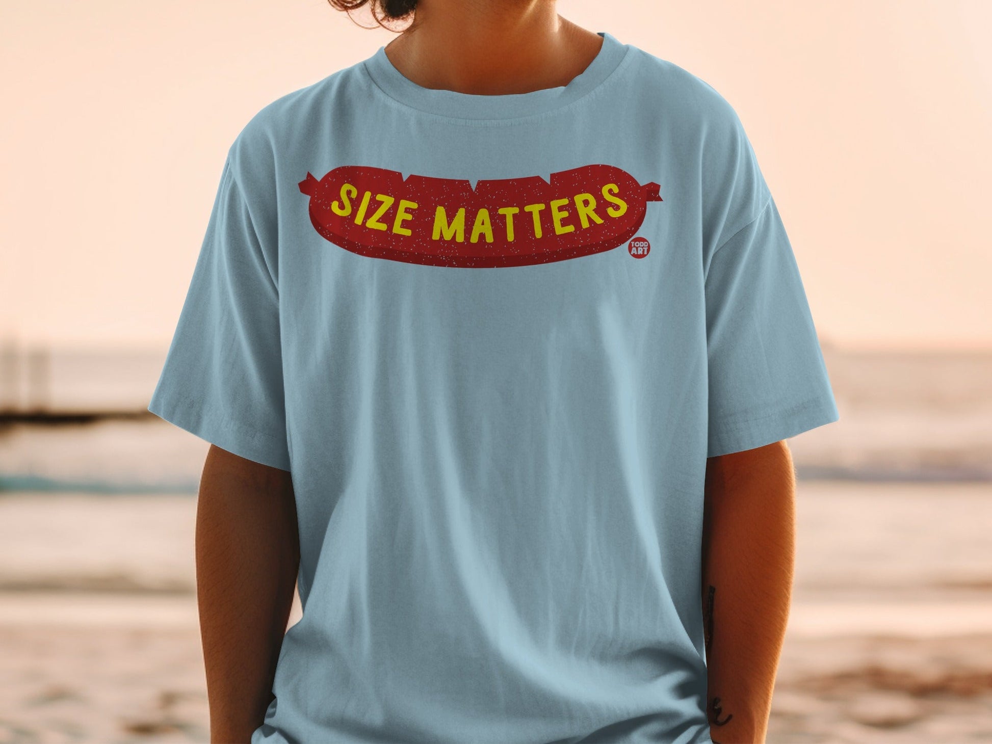 Light blue t-shirt with red "SIZE MATTERS" text and logo on front.