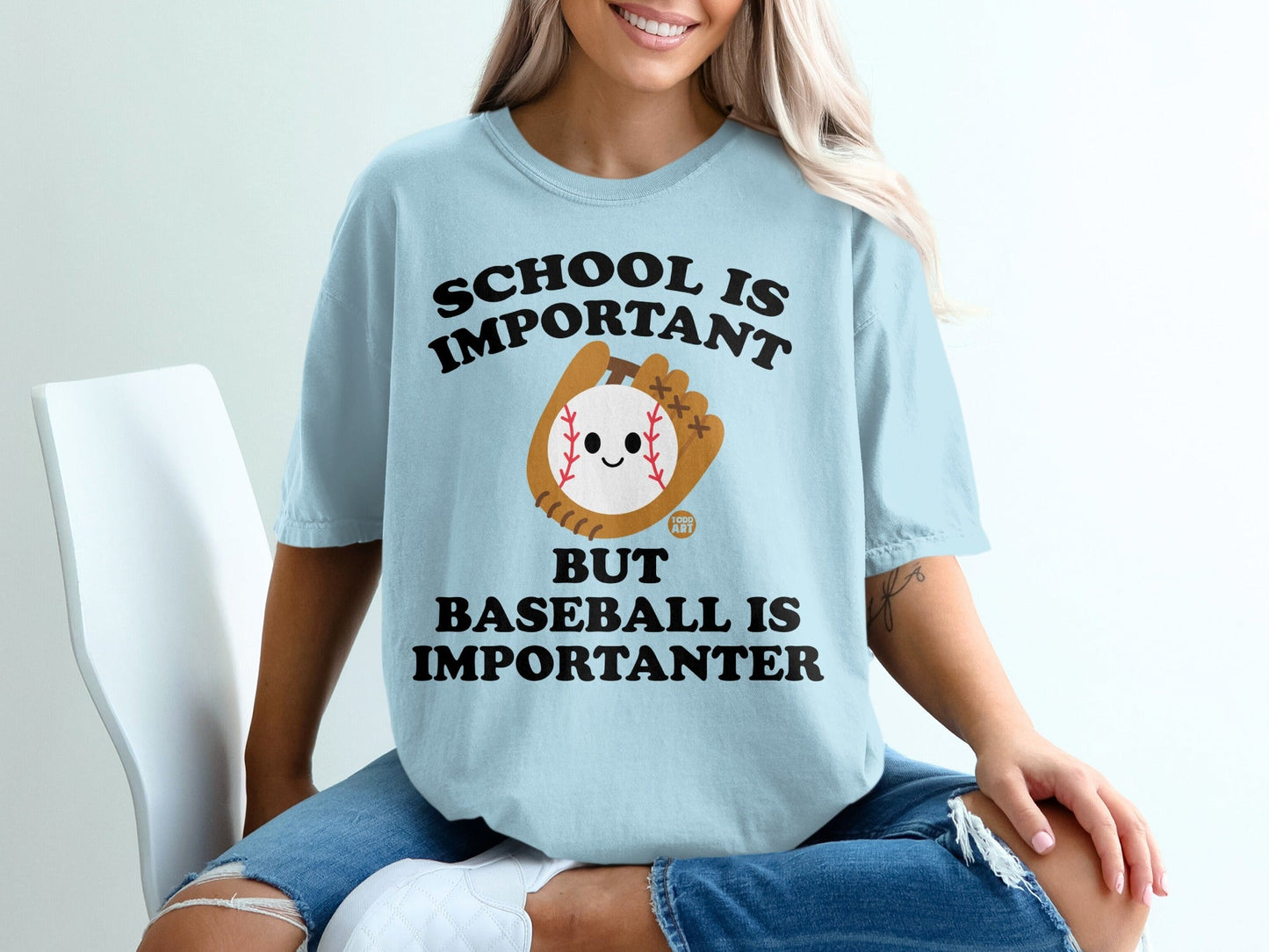 Light blue t-shirt with baseball graphic and "School is Important but Baseball is Importanter" text.