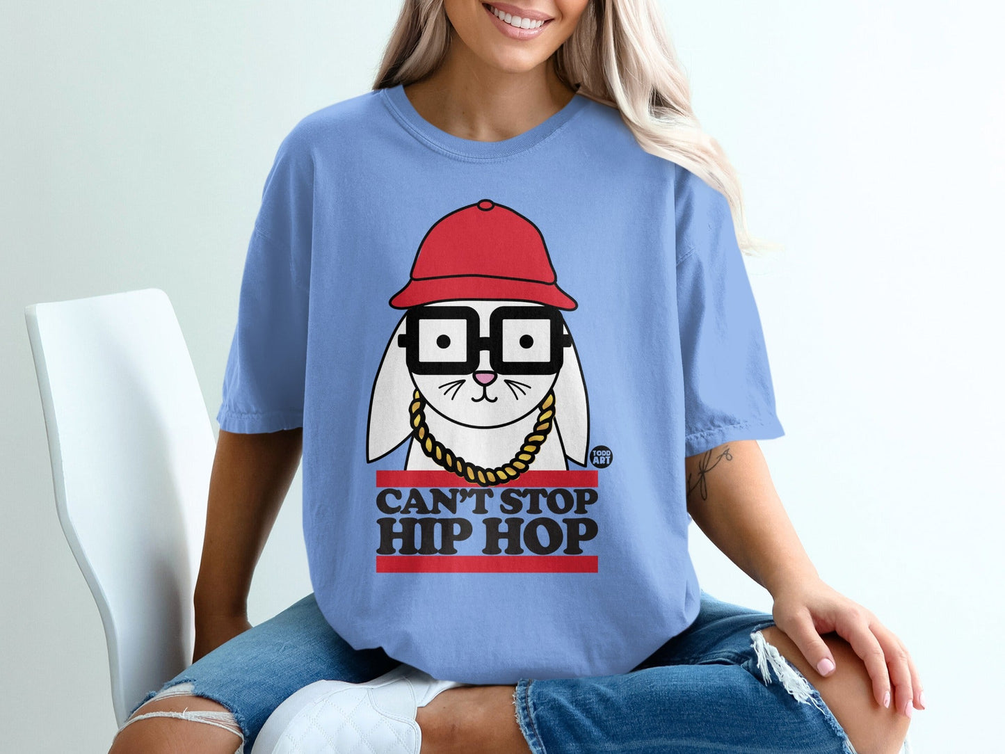 Blue t-shirt with "CAN'T STOP HIP HOP" text and a cartoon rabbit.