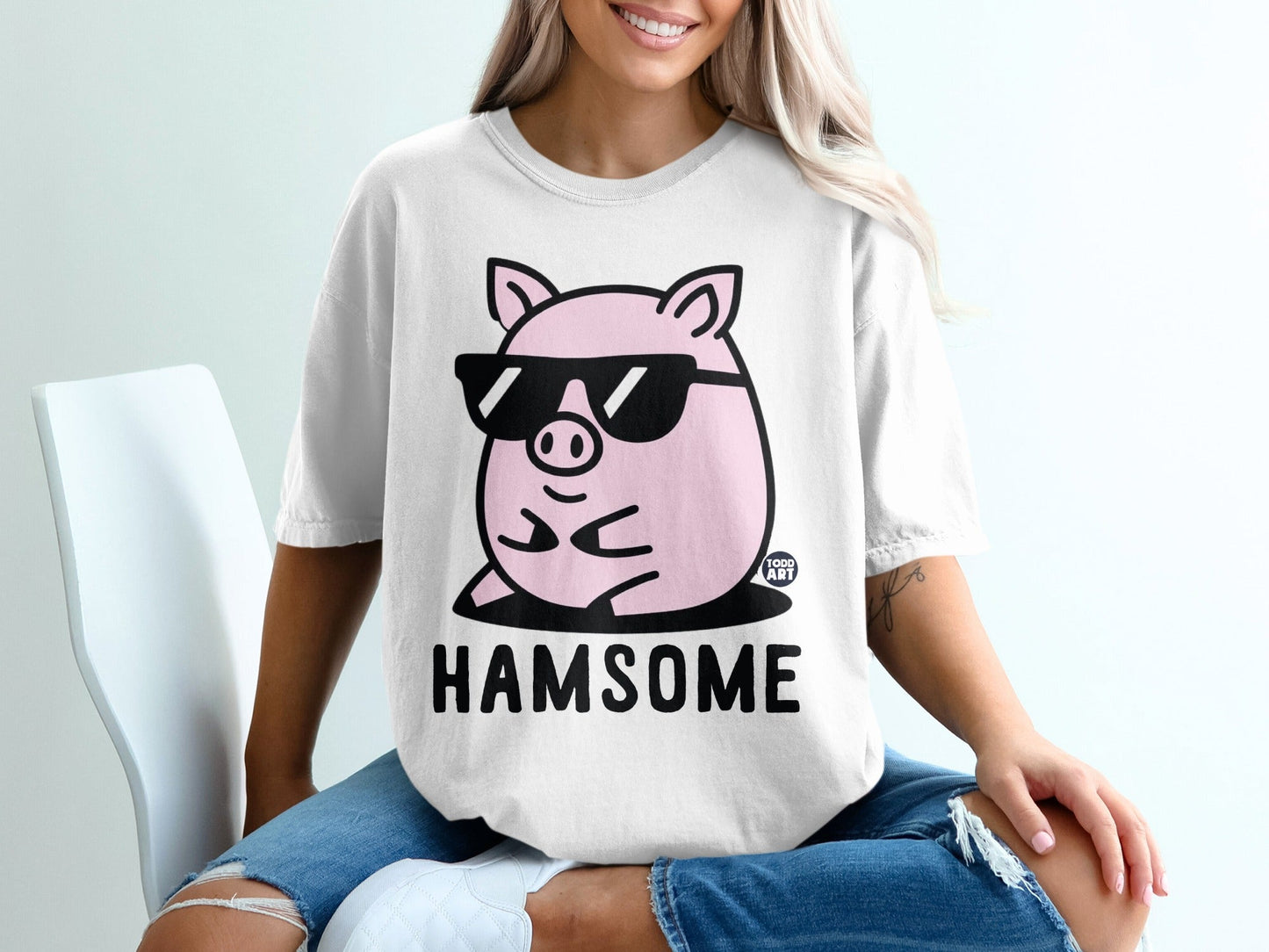 Pink pig with sunglasses on a t-shirt, "HAMSOME" text.
